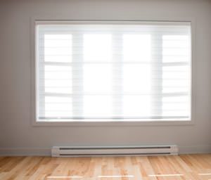 A radiant heating system underneath a window in a St. Croix Valley home