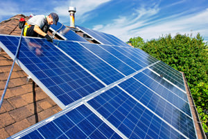 Solar energy paneling installed on a roof of a St. Croix Valley home