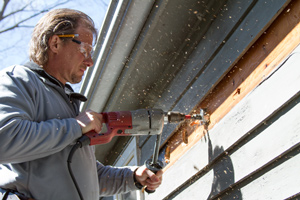 Wall Insulation into exterior siding in Hastings